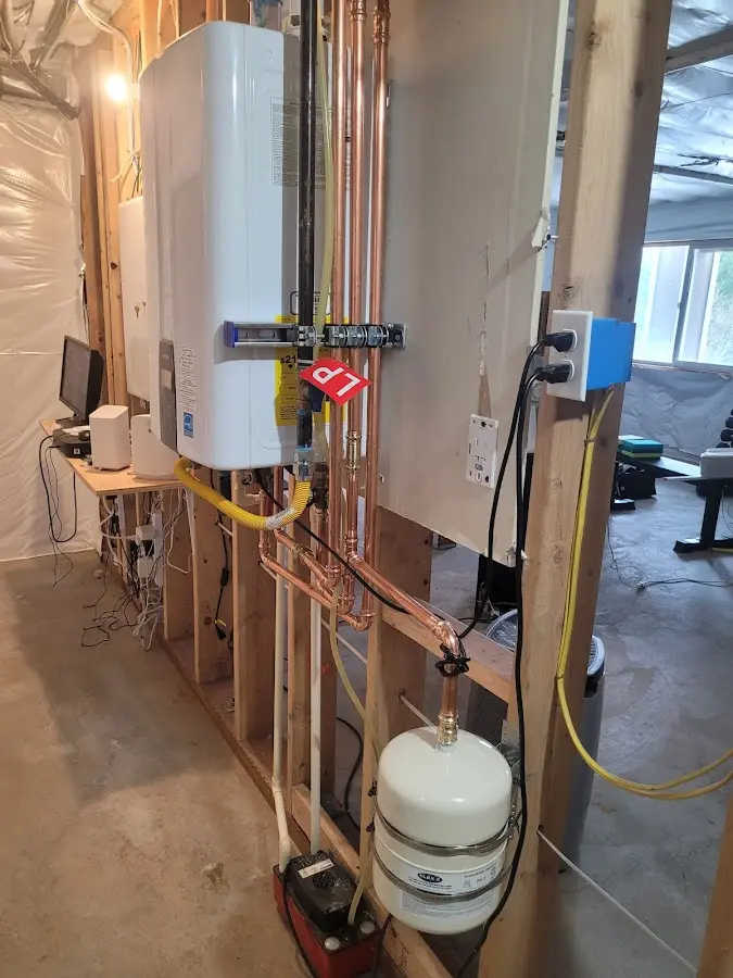 Licensed plumber repairing a kitchen sink in Whiteford